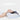 Butterfly-shaped memory foam neck pillow provides orthopedic neck support and cervical comfort for a resting woman.