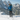Hiker in blue jacket on snowy alpine trail uses AscendLite feather-light carbon hiking poles.