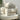 Cat Carrier Backpack - Stylish Pet Travel Bag, white quilted carrier with cat peeking from mesh window on cozy chair