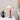 Elegant Wooden Desk Lamp on bedside table with white shade and wooden stem beside black vase with yellow tulips