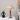 Clastered Elegant Wooden Desk Lamp with tapered wood base and beige conical shade on bedside table