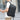 Man wearing black Laptop Backpack Lightweight Expandable Durable with durable nylon shell and sleek front pocket.