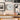 Nordic Minimalist Wall Clock  Silent Quartz Clock hangs on a wall above a wooden desk in a modern room.